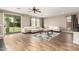 Comfortable living room with luxury vinyl plank flooring, a cozy seating area, and lots of natural light at 19415 W Colter St, Litchfield Park, AZ 85340