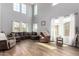Spacious living room featuring hardwood floors, a comfortable seating area, and lots of natural light at 19415 W Colter St, Litchfield Park, AZ 85340
