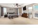 Spacious main bedroom with neutral tones, ample natural light, and a ceiling fan at 19415 W Colter St, Litchfield Park, AZ 85340