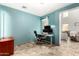 Bright office with tile flooring and a large window overlooking the yard at 19415 W Colter St, Litchfield Park, AZ 85340