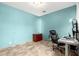 Well-lit office featuring tile flooring and a comfortable desk chair at 19415 W Colter St, Litchfield Park, AZ 85340