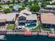 Expansive home with a backyard oasis, featuring a pool, hot tub, and private dock, all overlooking the serene water at 20657 N 56Th Ave, Glendale, AZ 85308