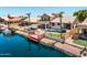 Gorgeous home with waterfront access, featuring a pool, hot tub, outdoor kitchen, and a private dock for boating at 20657 N 56Th Ave, Glendale, AZ 85308