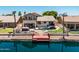 Stunning backyard oasis with pool, spa, waterfront access, and outdoor entertainment area at 20657 N 56Th Ave, Glendale, AZ 85308