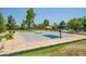 Community basketball court with shade trees, benches, and a playground nearby at 20657 N 56Th Ave, Glendale, AZ 85308