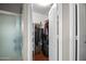 Walk-in closet with ample storage space and custom shelving at 20657 N 56Th Ave, Glendale, AZ 85308