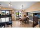 A dining room with a table set for four, view of the waterway, and stairway to the lower level at 20657 N 56Th Ave, Glendale, AZ 85308