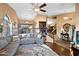 Open-concept living area with a staircase, hardwood floors, and a view of the dining area at 20657 N 56Th Ave, Glendale, AZ 85308