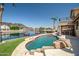 Inviting pool area with beautiful water views, lush landscaping, and outdoor seating at 20657 N 56Th Ave, Glendale, AZ 85308