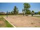 Community volleyball court with shade trees, benches, and a park nearby at 20657 N 56Th Ave, Glendale, AZ 85308