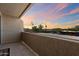 Balcony with sunset views, concrete floor, and stucco walls at 2134 E Broadway Rd # 2031, Tempe, AZ 85282