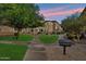 Exterior view of property with landscaping, mature trees, and walkways at 2134 E Broadway Rd # 2031, Tempe, AZ 85282