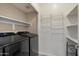 Laundry room with modern washer and dryer and shelving at 2134 E Broadway Rd # 2031, Tempe, AZ 85282