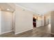 Open-concept space showcasing a view of kitchen with neutral walls and wood-look flooring at 2134 E Broadway Rd # 2031, Tempe, AZ 85282
