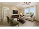 Inviting living room with vaulted ceiling, large windows and comfortable seating, perfect for relaxation at 2134 E Broadway Rd # 2031, Tempe, AZ 85282