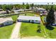 Aerial view of charming home with large lawn, mature trees, and a driveway at 215 W Ruth Ave, Phoenix, AZ 85021