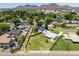 Expansive aerial view of a fenced property with mountain views in the surrounding residential neighborhood at 215 W Ruth Ave, Phoenix, AZ 85021