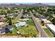 An aerial view highlights this property with its green lawn, fencing, and surrounding neighborhood at 215 W Ruth Ave, Phoenix, AZ 85021