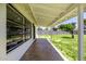 Spacious covered back porch with a concrete floor, providing ample space for outdoor enjoyment at 215 W Ruth Ave, Phoenix, AZ 85021