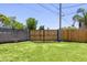 Backyard with metal gate to separate part of yard and wood fence at 215 W Ruth Ave, Phoenix, AZ 85021