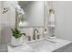Close-up of a bathroom with a marble countertop, modern faucet, and decorative accents at 215 W Ruth Ave, Phoenix, AZ 85021