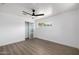 This well-lit bedroom boasts a ceiling fan, modern floors, and a closet at 215 W Ruth Ave, Phoenix, AZ 85021