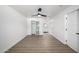 Spacious bedroom featuring modern ceiling fan, walk-in closet, and sleek wood flooring at 215 W Ruth Ave, Phoenix, AZ 85021