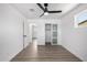 Inviting bedroom with light-filled window, closet, ceiling fan and stylish wood-look floors at 215 W Ruth Ave, Phoenix, AZ 85021