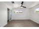 Bedroom featuring wood-look floors, a ceiling fan, and windows offering natural light at 215 W Ruth Ave, Phoenix, AZ 85021