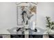 Close up of glass dining table with elegant decorations including flowers, wine and decorative vases on a table runner at 215 W Ruth Ave, Phoenix, AZ 85021