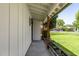 Charming front porch featuring a concrete walkway, wood columns, and manicured landscaping at 215 W Ruth Ave, Phoenix, AZ 85021