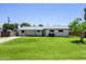 Charming single-story home with well-manicured lawn and updated neutral exterior paint at 215 W Ruth Ave, Phoenix, AZ 85021