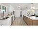 Bright modern kitchen with white cabinetry, stainless steel appliances, and a large island perfect for entertaining at 215 W Ruth Ave, Phoenix, AZ 85021