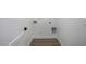 Functional laundry room with white walls, wood-look floors, and hookups for a washer and dryer at 215 W Ruth Ave, Phoenix, AZ 85021