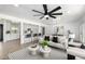 Bright living room featuring an open floor plan and contemporary finishes with open kitchen bar at 215 W Ruth Ave, Phoenix, AZ 85021