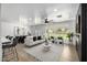 Open-concept living area showcasing a modern aesthetic, leading to the dining and kitchen spaces at 215 W Ruth Ave, Phoenix, AZ 85021