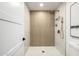 Modern shower featuring stylish tiles, a rainfall shower head, and a built-in niche at 215 W Ruth Ave, Phoenix, AZ 85021