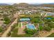 Scenic aerial view of the community's sports facilities with tennis courts, baseball field, and lush greenery at 2221 W Calle De Las Estrella Way, Phoenix, AZ 85085