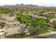 Stunning aerial view of desert community featuring lush green landscaping and a private backyard pool at 2221 W Calle De Las Estrella Way, Phoenix, AZ 85085