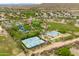 Aerial view of a community recreation center featuring tennis courts, basketball court, and sand volleyball at 2221 W Calle De Las Estrella Way, Phoenix, AZ 85085