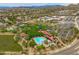 Stunning aerial view of the community pool and recreational area, set against a backdrop of picturesque desert landscape at 2221 W Calle De Las Estrella Way, Phoenix, AZ 85085