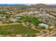 Wide aerial shot displays numerous community amenities including a playground, pool, and sports fields at 2221 W Calle De Las Estrella Way, Phoenix, AZ 85085