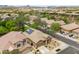Aerial view of the property showcasing solar panels, desert landscaping, and the surrounding residential neighborhood at 2221 W Calle De Las Estrella Way, Phoenix, AZ 85085