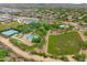 Panoramic view of community amenities including tennis courts, pools and grassy sports fields at 2221 W Calle De Las Estrella Way, Phoenix, AZ 85085
