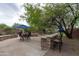 Backyard featuring a built-in BBQ with seating and patio furniture for outdoor gatherings at 2221 W Calle De Las Estrella Way, Phoenix, AZ 85085