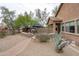 Spacious backyard with patio, fireplace, and desert landscaping, offering a private outdoor retreat at 2221 W Calle De Las Estrella Way, Phoenix, AZ 85085