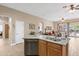 The kitchen island has stainless steel appliances and plenty of counter space at 2221 W Calle De Las Estrella Way, Phoenix, AZ 85085