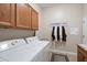 Laundry room with cabinets, utility sink, washer, and dryer at 2221 W Calle De Las Estrella Way, Phoenix, AZ 85085