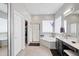 Bright main bathroom featuring walk-in shower, corner bathtub, double vanity, and neutral tile floor at 2221 W Calle De Las Estrella Way, Phoenix, AZ 85085