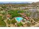Stunning aerial view of the community pool and recreational area, set against a backdrop of picturesque desert landscape at 2221 W Calle De Las Estrella Way, Phoenix, AZ 85085